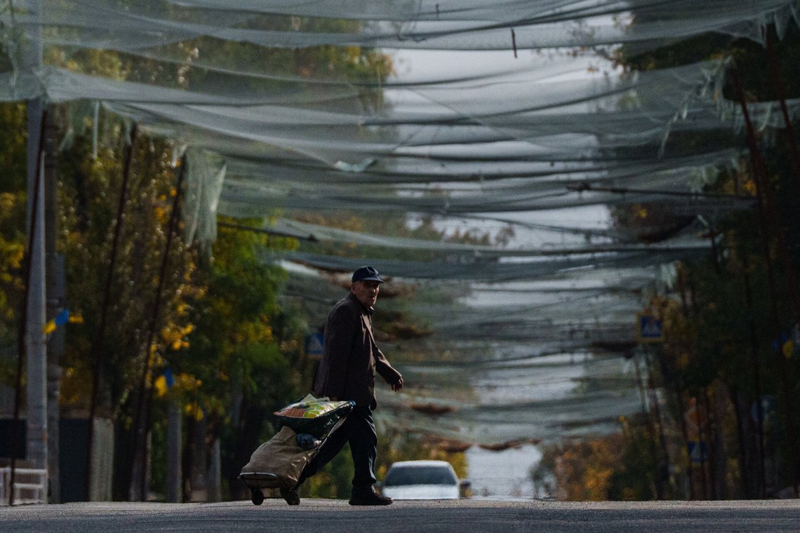 A local man walks beneath anti-drone nets stretched over a street during a local ceasefire related to a humanitarian aid mission in Oleshky, in Kherson, Ukraine, Wednesday, Oct. 28, 2026. (AP Photo/Evgeniy Maloletka) A local man walks beneath anti-drone nets stretched over a street during a local ceasefire related to a humanitarian aid mission in Oleshky, in Kherson, Ukraine, Wednesday, Oct. 28, 2026. (AP Photo/Evgeniy Maloletka)