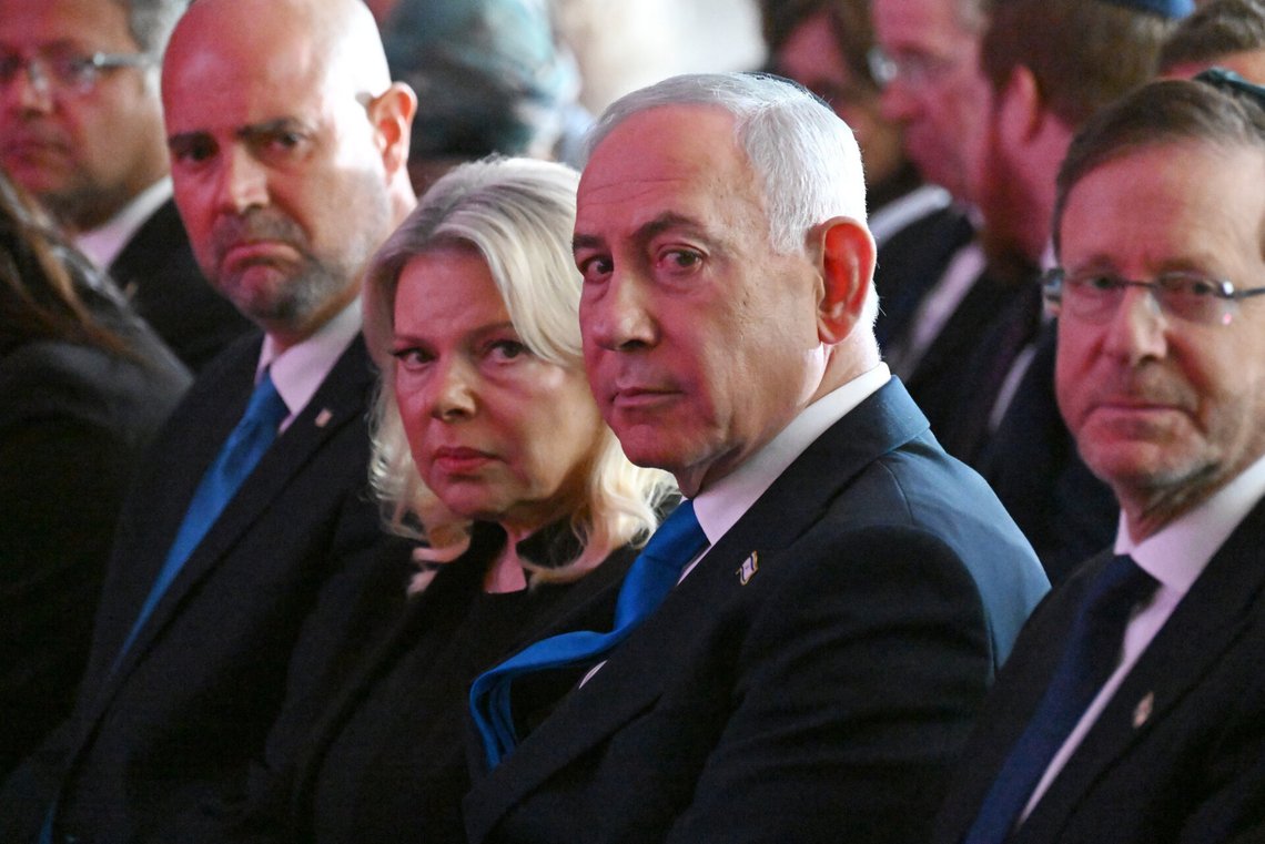 Israel's Prime Minister Benjamin Netanyahu, center right, and his wife Sara, center left, attend a state memorial ceremony in memory of those killed in the Oct. 7, 2023, Hamas attack on Israel, at Mount Herzl Cemetery in Jerusalem, Monday, Oct. 5, 2026. (Debbie Hill/Pool Photo via AP) ADDITION: Adds context of memorial ceremony. Israel's Prime Minister Benjamin Netanyahu, center right, and his wife Sara, center left, attend a state memorial ceremony in memory of those killed in the Oct. 7, 2023, Hamas attack on Israel, at Mount Herzl Cemetery in Jerusalem, Monday, Oct. 5, 2026. (Debbie Hill/Pool Photo via AP) ADDITION: Adds context of memorial ceremony.