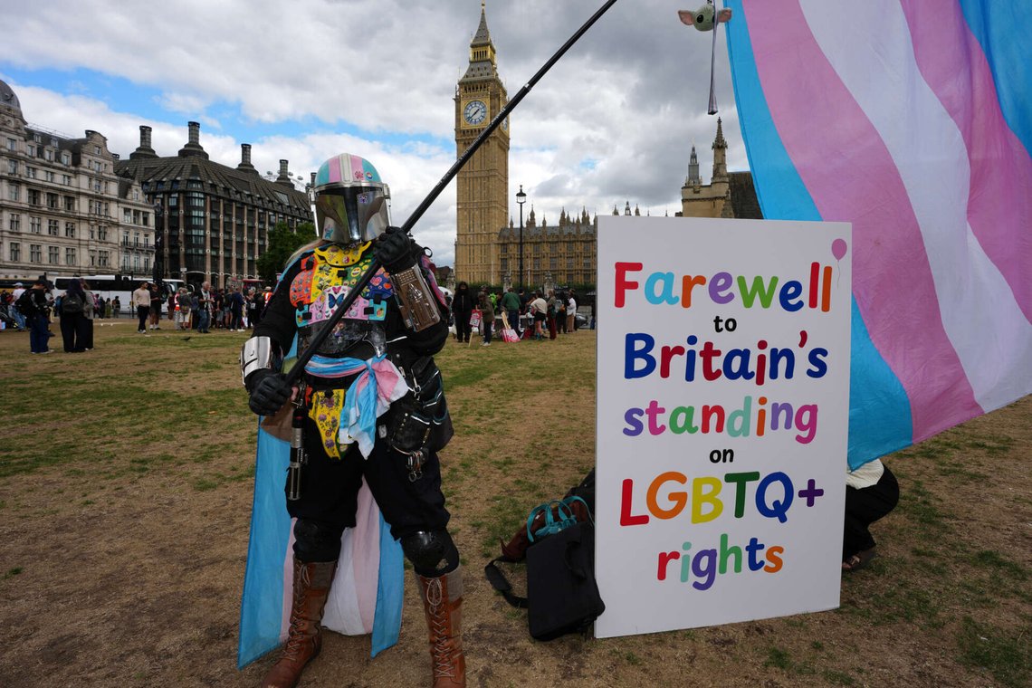 Jazz Lander, a protester from the Trans+Solidarity Alliance, waves a transgender pride flag as the group participates in a mass lobby in Parliament following the adoption of the European Convention on Human Rights single-sex guidance, which enforced the Supreme Court's ruling on biological sex, in London, Wednesday, Sept. 9, 2026. (AP Photo/Kin Cheung) Jazz Lander, a protester from the Trans+Solidarity Alliance, waves a transgender pride flag as the group participates in a mass lobby in Parliament following the adoption of the European Convention on Human Rights single-sex guidance, which enforced the Supreme Court's ruling on biological sex, in London, Wednesday, Sept. 9, 2026. (AP Photo/Kin Cheung)