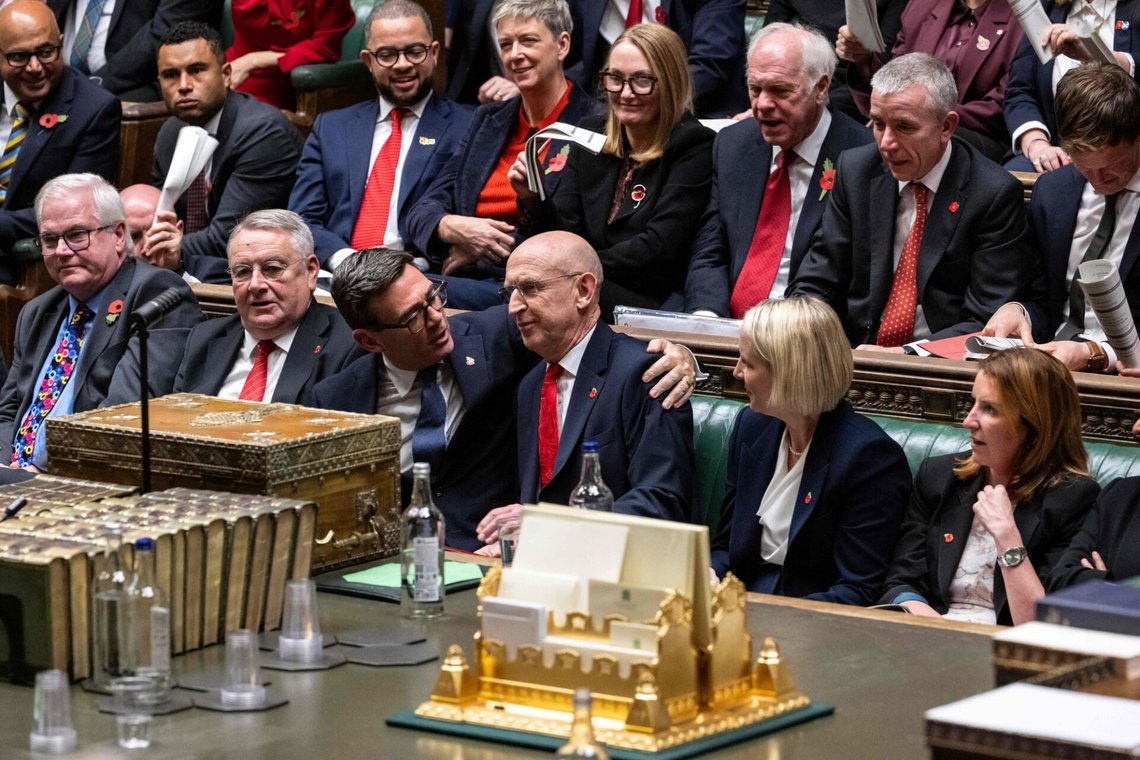 A handout photograph released by the UK Parliament's House of Commons shows Britain's Prime Minister Andy Burnham hugging Britain's Chancellor of the Exchequer John Healey in the House of Commons, central London, on October 28, 2026, as the government delivered its annual budget. (Photo by House of Commons / AFP) / RESTRICTED TO EDITORIAL USE - NO USE FOR ENTERTAINMENT, SATIRICAL, ADVERTISING PURPOSES - MANDATORY CREDIT " AFP PHOTO / HO / House of Commons" A handout photograph released by the UK Parliament's House of Commons shows Britain's Prime Minister Andy Burnham hugging Britain's Chancellor of the Exchequer John Healey in the House of Commons, central London, on October 28, 2026, as the government delivered its annual budget. (Photo by House of Commons / AFP) / RESTRICTED TO EDITORIAL USE - NO USE FOR ENTERTAINMENT, SATIRICAL, ADVERTISING PURPOSES - MANDATORY CREDIT " AFP PHOTO / HO / House of Commons"