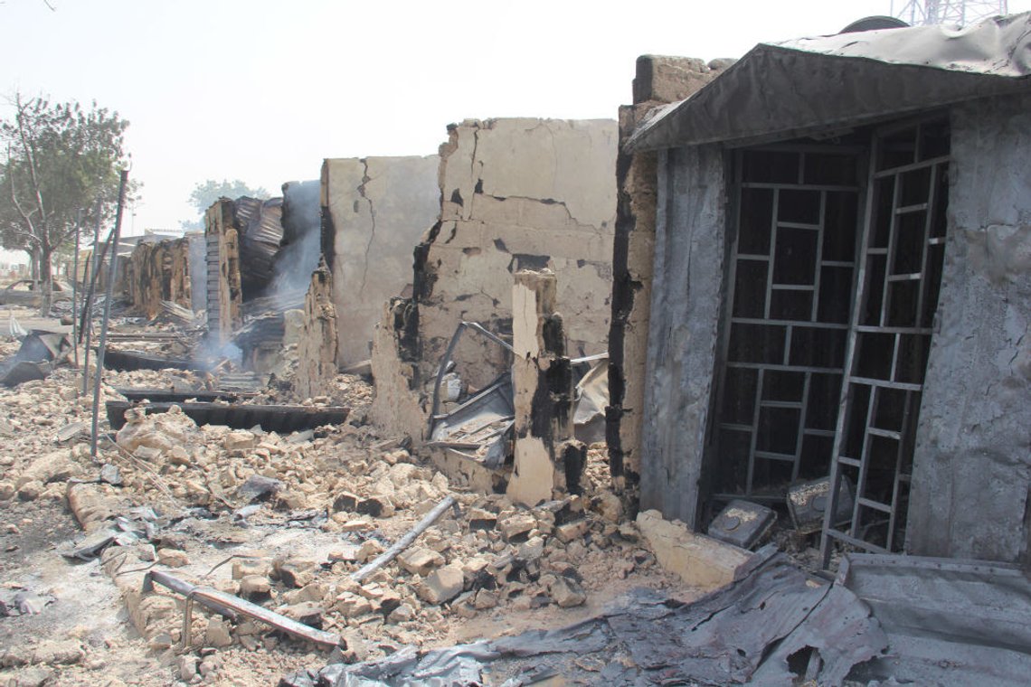 In this photograph taken in Auno on February 10, 2020, shops burnt down by suspected members of the Islamic State West Africa Province (ISWAP) during an attack on February 9, 2020, is seen. - Jihadists killed at least 30 people and abducted women and children in a raid in northeast Nigeria's restive Borno state, a regional government spokesman said on February 10, 2020.The attack on February 9, 2020 targeted the village of Auno where jihadists stormed in on trucks mounted with heavy weapons, killing, burning and looting before kidnapping women and children. (Photo by AUDU MARTE / AFP) (Photo by AUDU MARTE/AFP via Getty Images) In this photograph taken in Auno on February 10, 2020, shops burnt down by suspected members of the Islamic State West Africa Province (ISWAP) during an attack on February 9, 2020, is seen. - Jihadists killed at least 30 people and abducted women and children in a raid in northeast Nigeria's restive Borno state, a regional government spokesman said on February 10, 2020.The attack on February 9, 2020 targeted the village of Auno where jihadists stormed in on trucks mounted with heavy weapons, killing, burning and looting before kidnapping women and children. (Photo by AUDU MARTE / AFP) (Photo by AUDU MARTE/AFP via Getty Images)