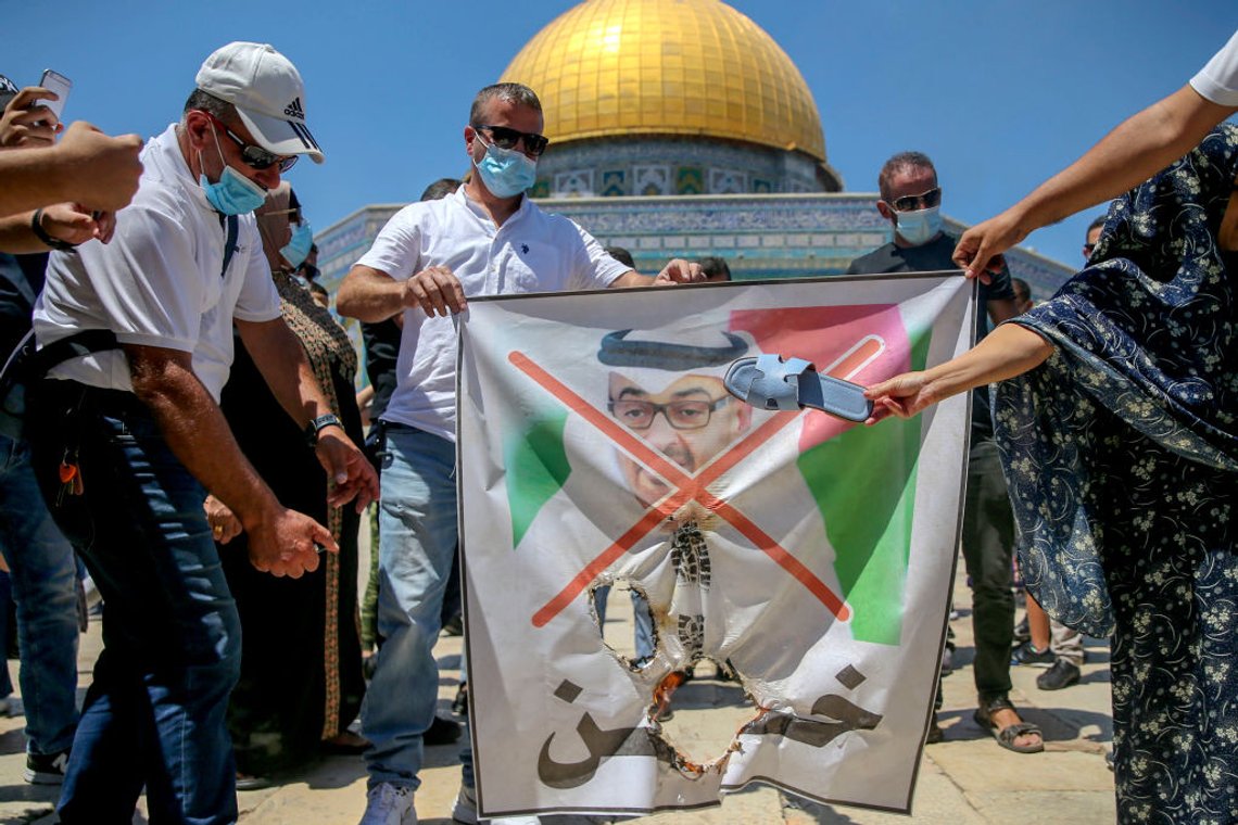 Palestinian protesters prepare to tear apart a portrait of Abu Dhabi Crown Prince Sheikh Mohammed bin Zayed al-Nahyan on August 14, 2020 at the al-Aqsa mosque compound in Jerusalem, during a protest against a US-brokered deal between Israel and the UAE to normalise relations. (Photo by - / AFP) (Photo by -/AFP via Getty Images) Palestinian protesters prepare to tear apart a portrait of Abu Dhabi Crown Prince Sheikh Mohammed bin Zayed al-Nahyan on August 14, 2020 at the al-Aqsa mosque compound in Jerusalem, during a protest against a US-brokered deal between Israel and the UAE to normalise relations. (Photo by - / AFP) (Photo by -/AFP via Getty Images)