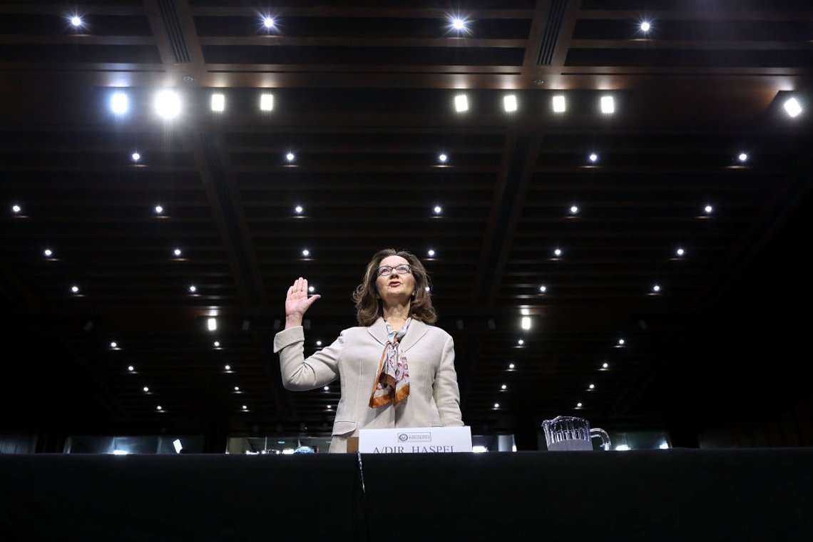 WASHINGTON, DC - MAY 09: Central Intelligence Agency Deputy Director Gina Haspel is sworn in before the Senate Intelligence Committee during her confirmation hearing to become the next CIA director in the Hart Senate Office Building May 9, 2018 in Washington, DC. If confirmed, Haspel would be the first woman to lead the nation's biggest spy agency. Haspel ran a secret 'black site' CIA prison in Thailand after September 11, 2001, where detainees were subjected to brutal interrogation techniques and she was later involved in approving the destruction of videotapes of interrogation sessions at that prison. (Photo by Chip Somodevilla/Getty Images) WASHINGTON, DC - MAY 09: Central Intelligence Agency Deputy Director Gina Haspel is sworn in before the Senate Intelligence Committee during her confirmation hearing to become the next CIA director in the Hart Senate Office Building May 9, 2018 in Washington, DC. If confirmed, Haspel would be the first woman to lead the nation's biggest spy agency. Haspel ran a secret 'black site' CIA prison in Thailand after September 11, 2001, where detainees were subjected to brutal interrogation techniques and she was later involved in approving the destruction of videotapes of interrogation sessions at that prison. (Photo by Chip Somodevilla/Getty Images)