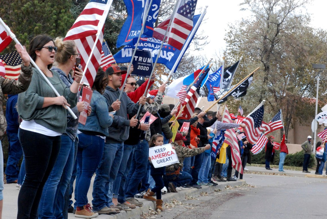 Hundreds of supporters of President Donald Trump stage a rally outside the New Mexico state Capitol building in Santa Fe, N.M., on Saturday, Nov. 7, 2020. They waved flags, chanted "four more years," and cheered and jeered at passing cars. A dozen supporters of Democrat Joe Biden gathered blocks away at the city's central plaza amid a heavy police presence. Democrat Joe Biden won the vote for New Mexico in the Nov. 3 election. (AP Photo/Morgan Lee) Hundreds of supporters of President Donald Trump stage a rally outside the New Mexico state Capitol building in Santa Fe, N.M., on Saturday, Nov. 7, 2020. They waved flags, chanted "four more years," and cheered and jeered at passing cars. A dozen supporters of Democrat Joe Biden gathered blocks away at the city's central plaza amid a heavy police presence. Democrat Joe Biden won the vote for New Mexico in the Nov. 3 election. (AP Photo/Morgan Lee)