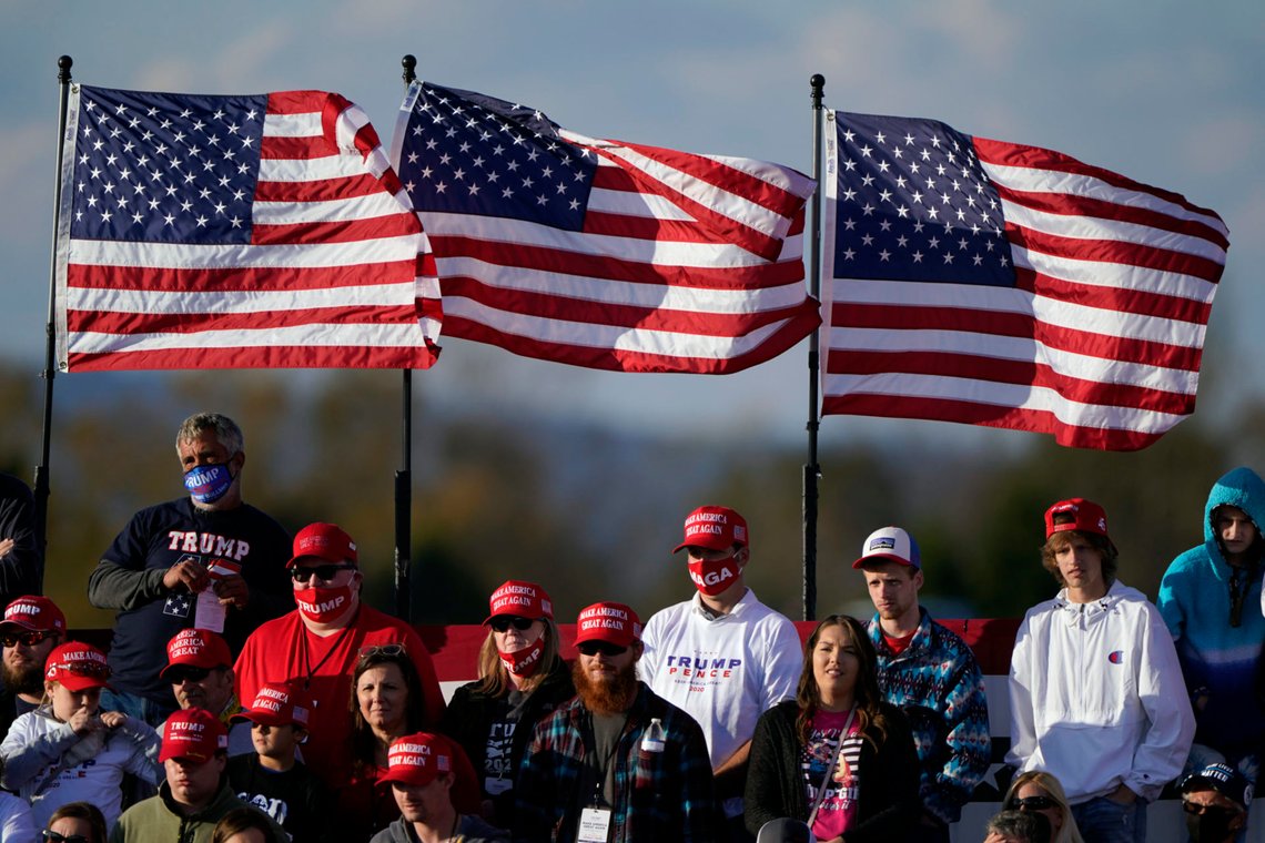 Supporters wait before President Donald Trump arrives to speak at a campaign rally on Sunday, Nov. 1, 2020, at Hickory Regional Airport in Hickory, N.C. (AP Photo/Chris Carlson) Supporters wait before President Donald Trump arrives to speak at a campaign rally on Sunday, Nov. 1, 2020, at Hickory Regional Airport in Hickory, N.C. (AP Photo/Chris Carlson)