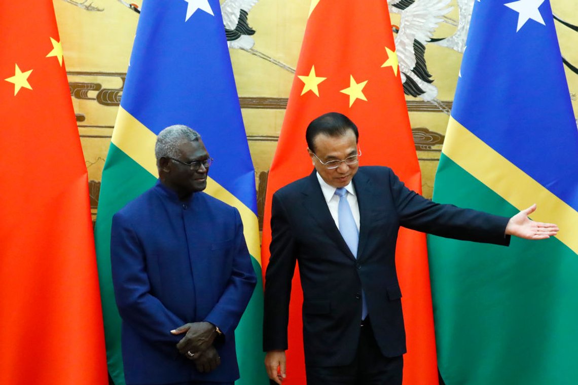 Solomon Islands Prime Minister Manasseh Sogavare (L) and Chinese Premier Li Keqiang attend a signing ceremony at the Great Hall of the People in Beijing on October 9, 2019. (Photo by THOMAS PETER / POOL / AFP) (Photo by THOMAS PETER/POOL/AFP via Getty Images) Solomon Islands Prime Minister Manasseh Sogavare (L) and Chinese Premier Li Keqiang attend a signing ceremony at the Great Hall of the People in Beijing on October 9, 2019. (Photo by THOMAS PETER / POOL / AFP) (Photo by THOMAS PETER/POOL/AFP via Getty Images)