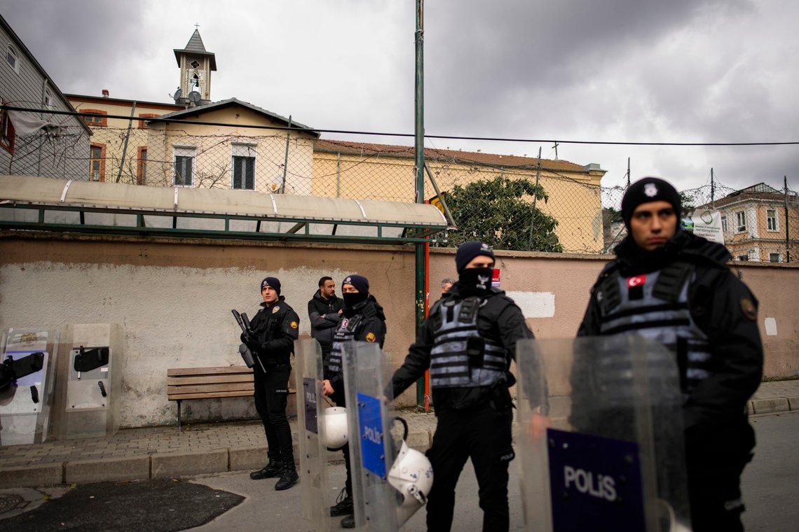 Turkish police officers stand guard in a cordoned off area outside the Santa Maria church, in Istanbul, Turkey, Sunday, Jan. 28, 2024. Two masked assailants attacked a church in Istanbul during Sunday services, killing one person, Turkish officials said. (AP Photo/Emrah Gurel) Turkish police officers stand guard in a cordoned off area outside the Santa Maria church, in Istanbul, Turkey, Sunday, Jan. 28, 2024. Two masked assailants attacked a church in Istanbul during Sunday services, killing one person, Turkish officials said. (AP Photo/Emrah Gurel)