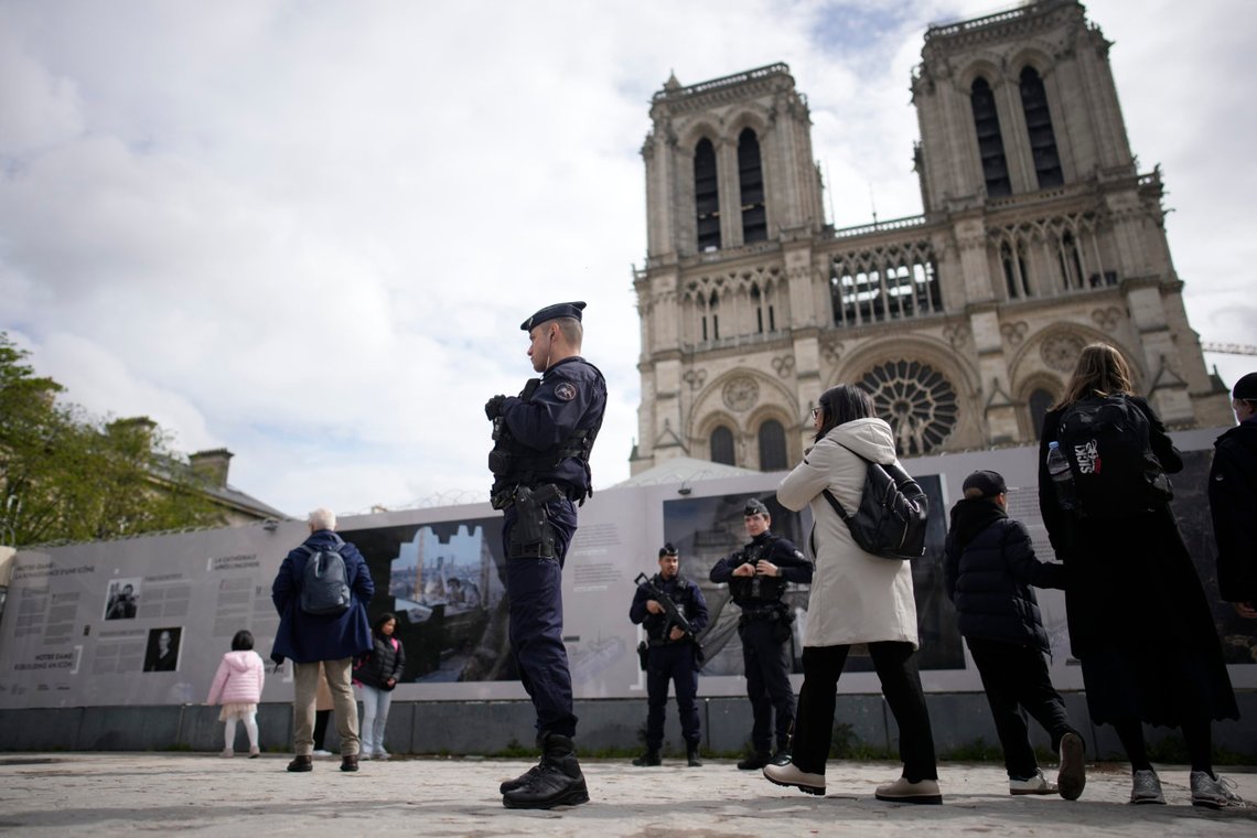 Police officers patrol outside Notre Dame cathedral ahead of a Good Friday ceremony, as part of Easter celebrations, Friday, March 29, 2024 in Paris. (AP Photo/Christophe Ena) Police officers patrol outside Notre Dame cathedral ahead of a Good Friday ceremony, as part of Easter celebrations, Friday, March 29, 2024 in Paris. (AP Photo/Christophe Ena)