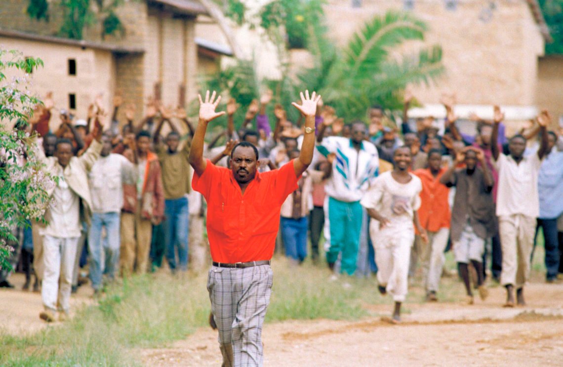 Rwandan refugees hold their hands up and ask for help from Belgian soldiers, who had come to a psychiatric hospital compound outside of Kigali on April 13, 1994. People are patients of this hospital. (AP Photo/Karsten Thielker, File) Rwandan refugees hold their hands up and ask for help from Belgian soldiers, who had come to a psychiatric hospital compound outside of Kigali on April 13, 1994. People are patients of this hospital. (AP Photo/Karsten Thielker, File)