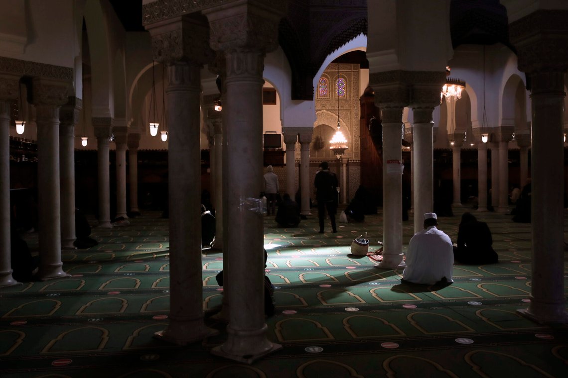 Muslims pray during the first day of the holy fasting month of Ramadan, at the Paris mosque, Tuesday, April 13, 2021. Ramadan is marked by daily fasting from dawn to sunset, ending with the Islamic holiday of Eid al-Fitr. (AP Photo/Christophe Ena) Muslims pray during the first day of the holy fasting month of Ramadan, at the Paris mosque, Tuesday, April 13, 2021. Ramadan is marked by daily fasting from dawn to sunset, ending with the Islamic holiday of Eid al-Fitr. (AP Photo/Christophe Ena)