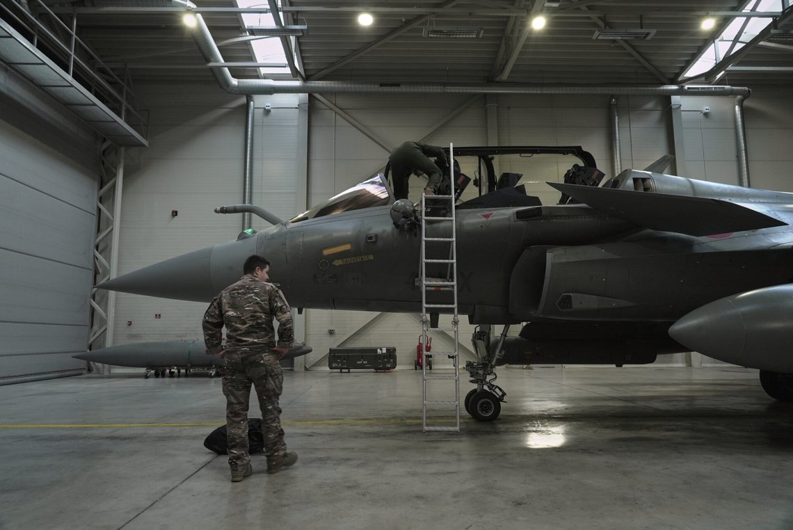 A flight-crew member climbs into the cockpit of a French air force Rafale fighter jet stationed on a NATO air-policing mission at the Siauliai Air Base in Lithuania as another member of the French detachment stands at the foot of the ladder on Sunday, April 19, 2026 (AP Photo/John Leicester) A flight-crew member climbs into the cockpit of a French air force Rafale fighter jet stationed on a NATO air-policing mission at the Siauliai Air Base in Lithuania as another member of the French detachment stands at the foot of the ladder on Sunday, April 19, 2026 (AP Photo/John Leicester)