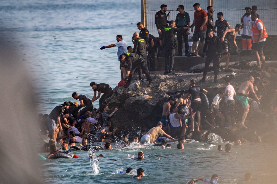 Migrants try to cross from Morocco into the Spanish enclave of Ceuta, Thursday, July 30, 2026. (AP Photo/Antonio Sempere) Migrants try to cross from Morocco into the Spanish enclave of Ceuta, Thursday, July 30, 2026. (AP Photo/Antonio Sempere)